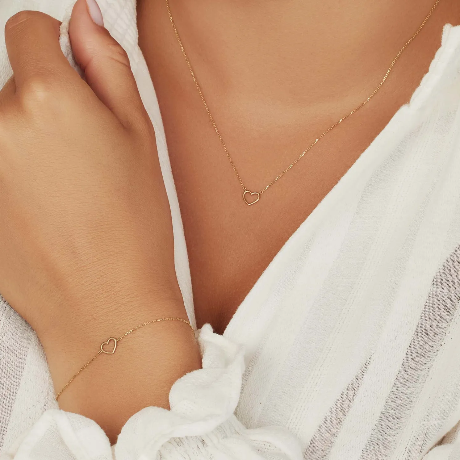 Cadeau d'Isabel 14 karaat gouden collier en armband giftset met hartje